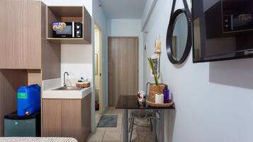 Premium bedding, desk, laptop workspace, blackout drapes