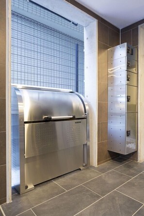 Access the floor via this sleek elevator with digital display and control panel.