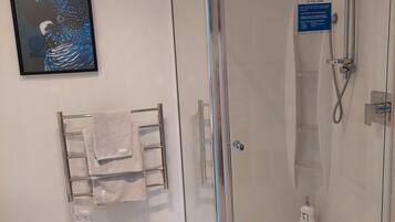 Shower, hair dryer, towels, soap