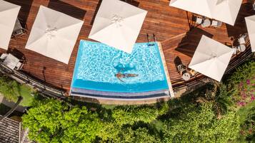 Outdoor pool, open 9:00 AM to 5:00 PM, pool umbrellas, pool loungers