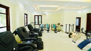A fitness center with exercise equipment, including treadmills, stationary bikes, and weight machines. - Bo Xay Dung Vung Tau (Ho Chi Minh City)