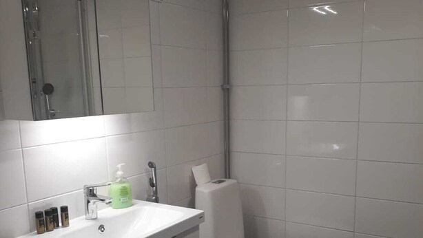 Apartment, 1 Bedroom | Bathroom | Shower, hair dryer, towels, soap - Kotimaailma Helsinki Punavuorenkatu 23 (Helsinki)