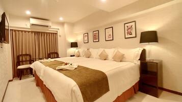 Premium bedding, down comforters, in-room safe, desk