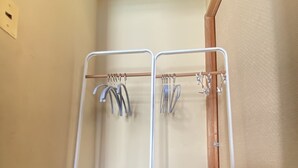 A room with a metal rack holding two pet beds and a wooden door. - Shibuya Japanese-style room 2DK small up to family 4 parsons + Pocket Wifi (渋谷区)