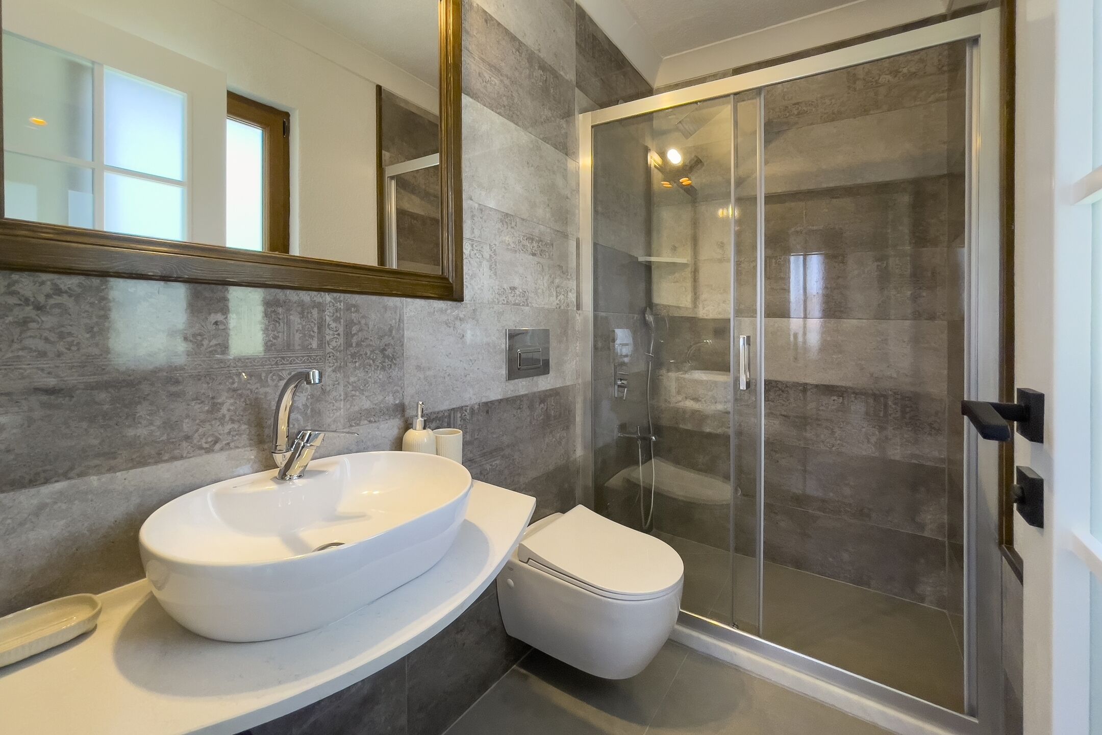 elite studio suite, partial sea view | bathroom | shower, rainfall showerhead, hair dryer, slippers