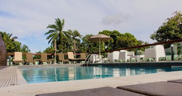 Outdoor pool, pool umbrellas, sun loungers