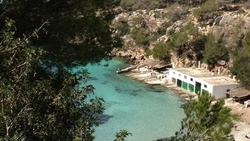 On the beach, sun loungers, beach towels
