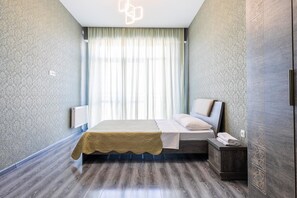 Apartment, 3 Bedrooms (Saakadze Square) | Desk, iron/ironing board, free WiFi