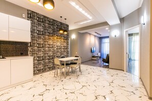 Apartment, 3 Bedrooms (Saakadze Square) | Living area | Flat-screen TV - Apartment on Saakadze Square (Tbilisi)