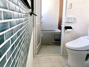 Apartment, 1 Bedroom | Bathroom | Separate bathtub and shower, deep-soaking bathtub, free toiletries