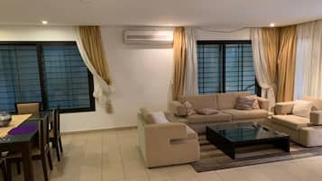 Deluxe Villa | Living area | Flat-screen TV