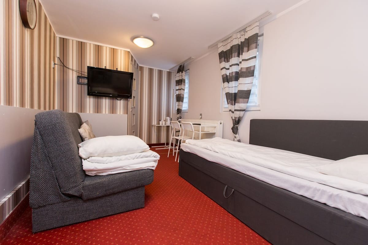 Twin Room | Laptop workspace, iron/ironing board (on request), free WiFi, bed sheets
