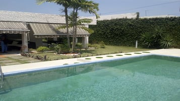 Outdoor pool, pool umbrellas, pool loungers