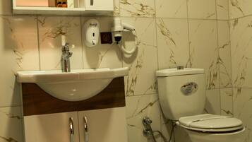 Suite, City View | Bathroom | Shower, hydromassage showerhead, free toiletries, hair dryer