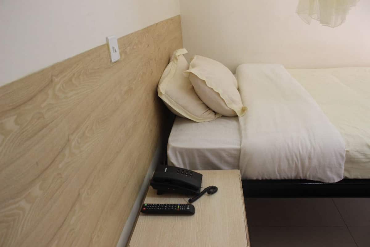Premium bedding, desk, laptop workspace, blackout curtains