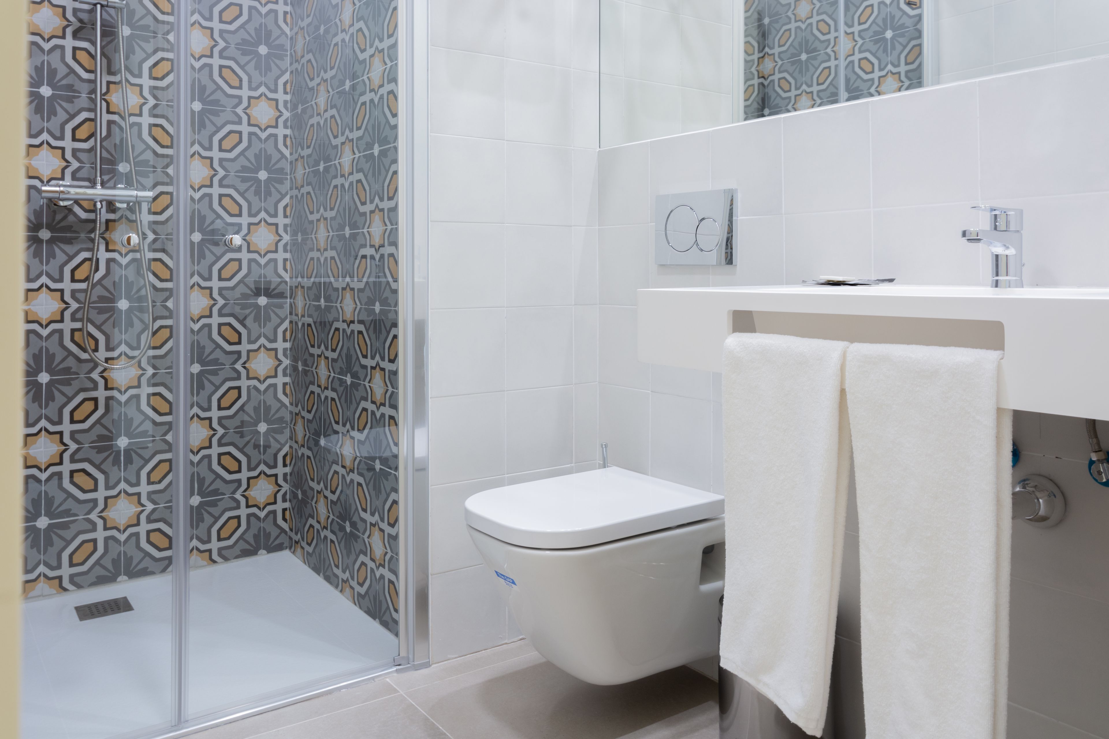 economy double room | bathroom | hair dryer, towels, soap, shampoo