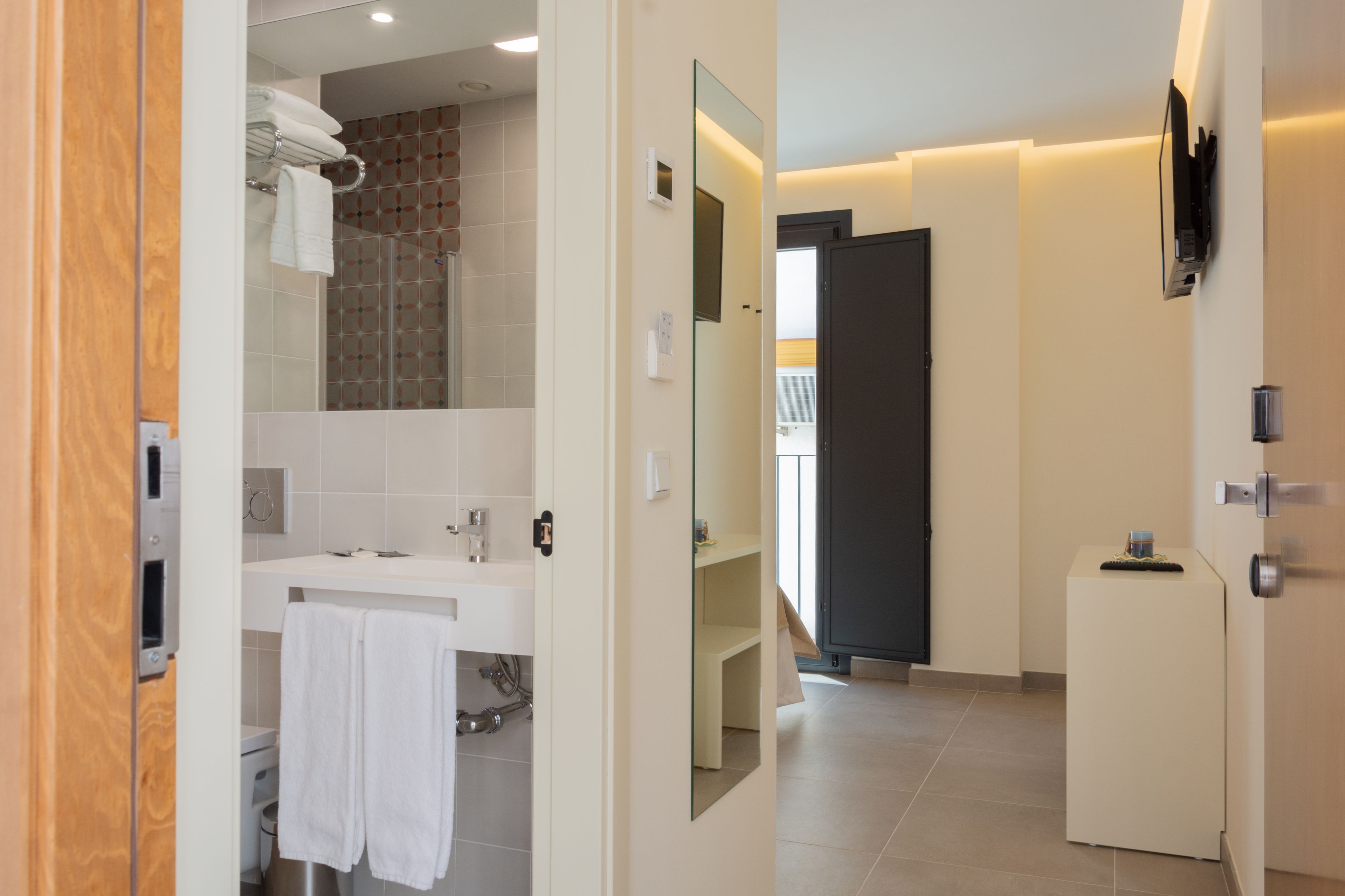 double room with extra bed | bathroom | hair dryer, towels, soap, shampoo