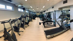 A gym with various exercise machines, including treadmills and weight equipment. - Tennis- und Freizeitzentrum Neudörfl (Neudoerfl)