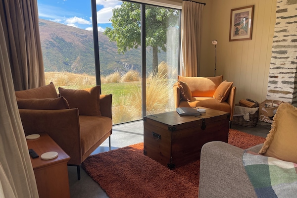 Cosy lounge with wood fire. Newly revamped in summer 2025