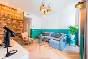 Deluxe Apartment, 1 Bedroom, City View | Living room | Flat-screen TV