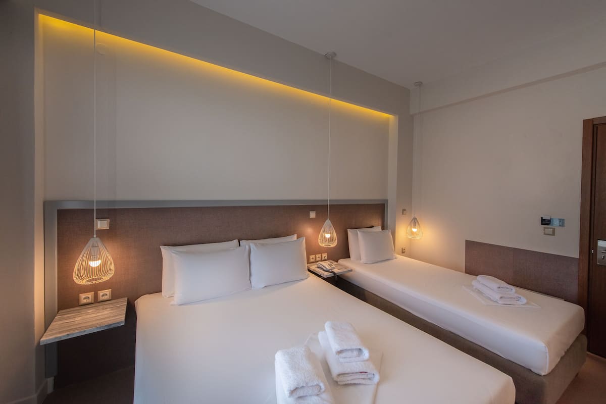 Family Triple Room | Egyptian cotton sheets, premium bedding, pillow-top beds, in-room safe