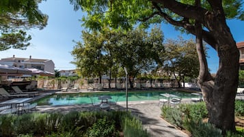 Seasonal outdoor pool, pool loungers