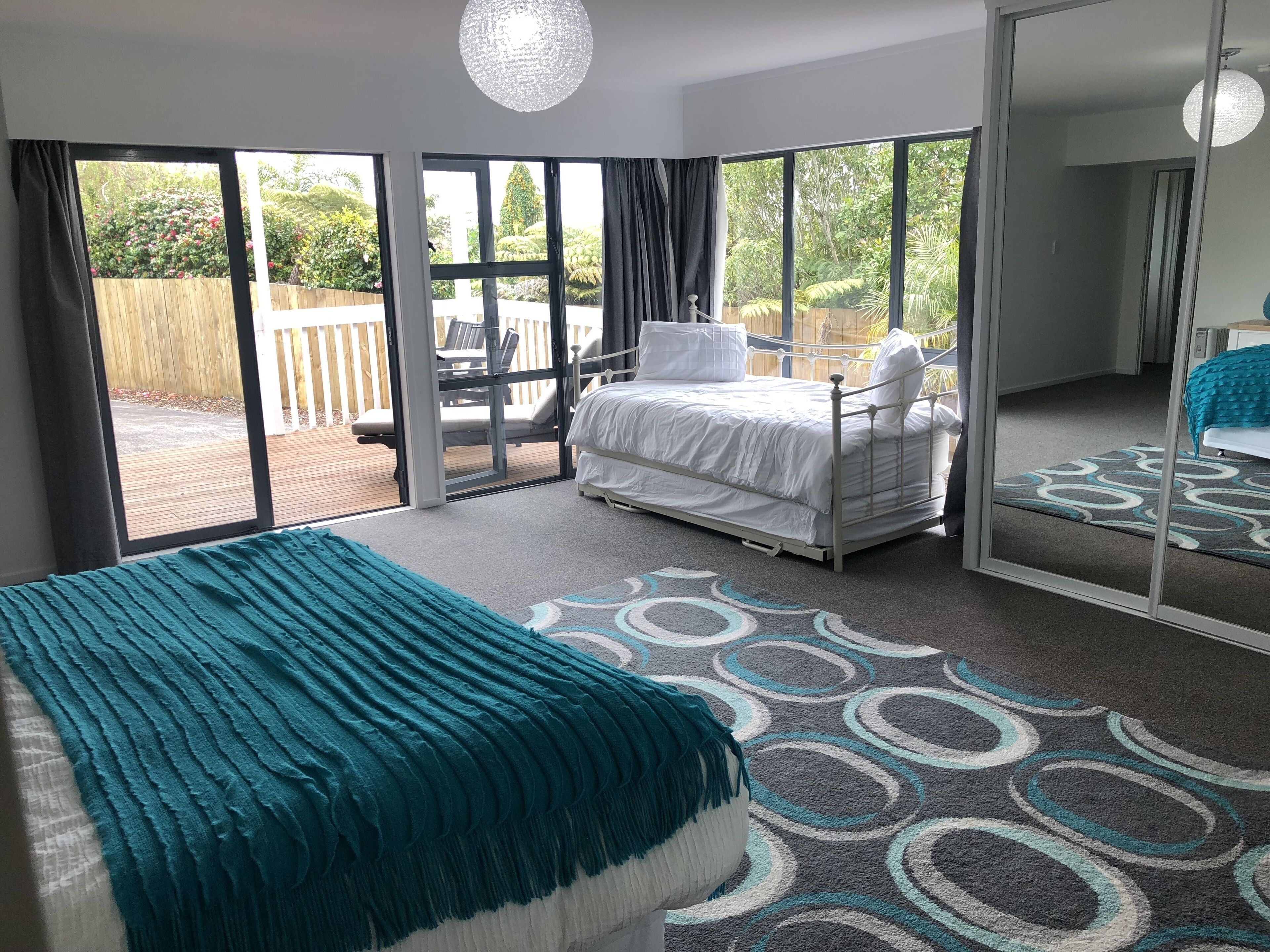 Master bedroom flows to north facing (all day sun) deck.