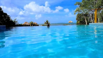 Outdoor pool, open 10:00 AM to 10:00 PM, pool umbrellas, sun loungers