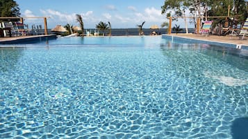 Outdoor pool, open 10:00 AM to 10:00 PM, pool umbrellas, pool loungers