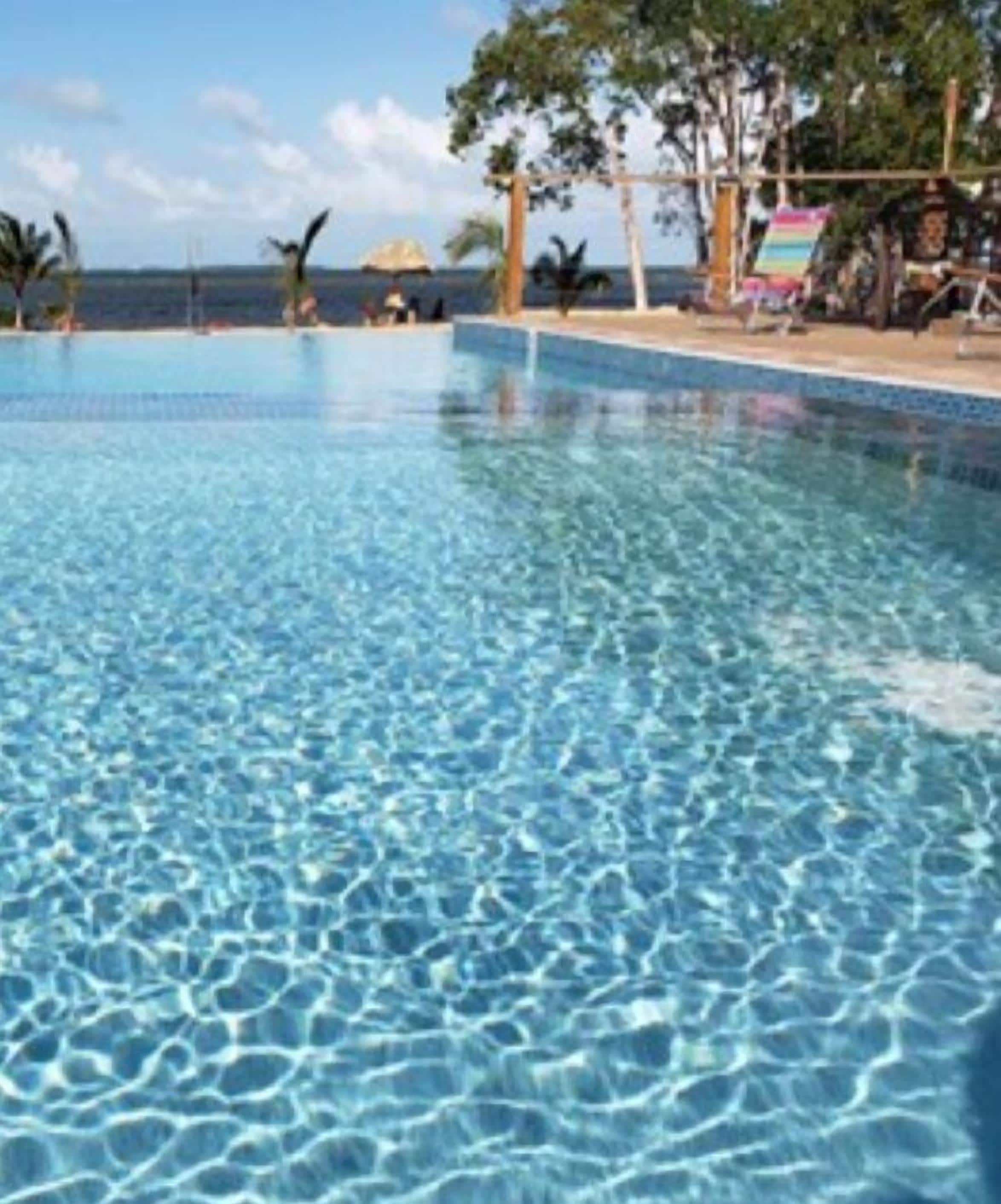 outdoor pool, open 10:00 am to 10:00 pm, pool umbrellas, pool loungers