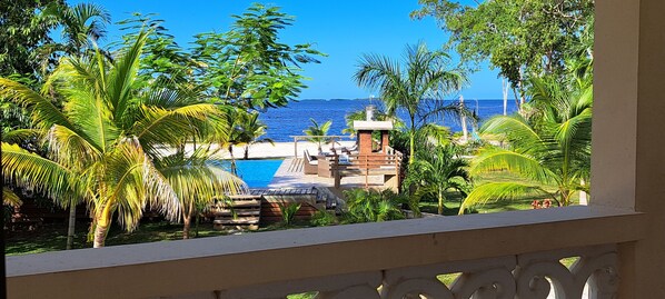 Outdoor pool, open 10:00 AM to 10:00 PM, pool umbrellas, pool loungers