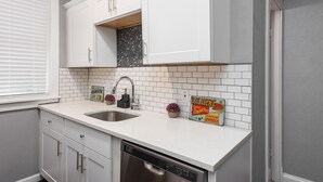 Signature Apartment, 1 Bedroom, Non Smoking, Kitchen | Private kitchen - Central Garden Getaways Corp Rentals by NamaStay (St. Louis)