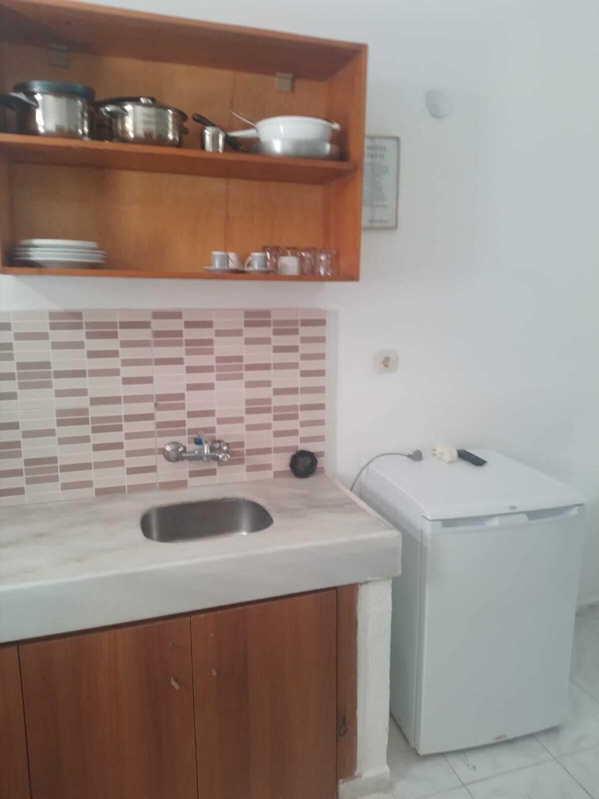 Fridge, stovetop, cookware/dishes/utensils, dining tables