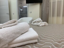 Deluxe Quadruple Room | Premium bedding, down comforters, minibar, individually furnished