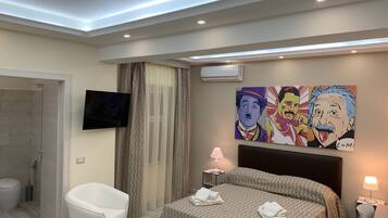 Deluxe Quadruple Room | Premium bedding, down comforters, minibar, individually furnished