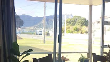 Enjoy a peaceful view of the surrounding residential area and distant mountains from the large window.