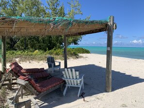 On the beach, sun-loungers, beach towels