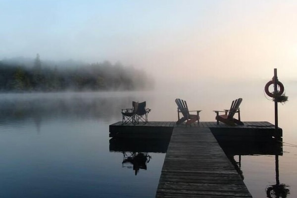 Only 1 other small cabin on this 87 acre spring fed lake with no public access.