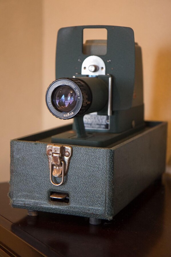 A vintage camera with a lens and a body, mounted on a textured box. - 8th Floor Studio in the Historic Wilma (Missoula)