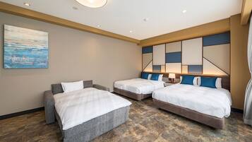 A hotel room with two single beds, a sofa, a painting on the wall, and a modern ceiling design.