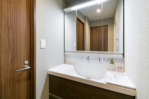 Separate tub and shower, hair dryer, bathrobes, slippers