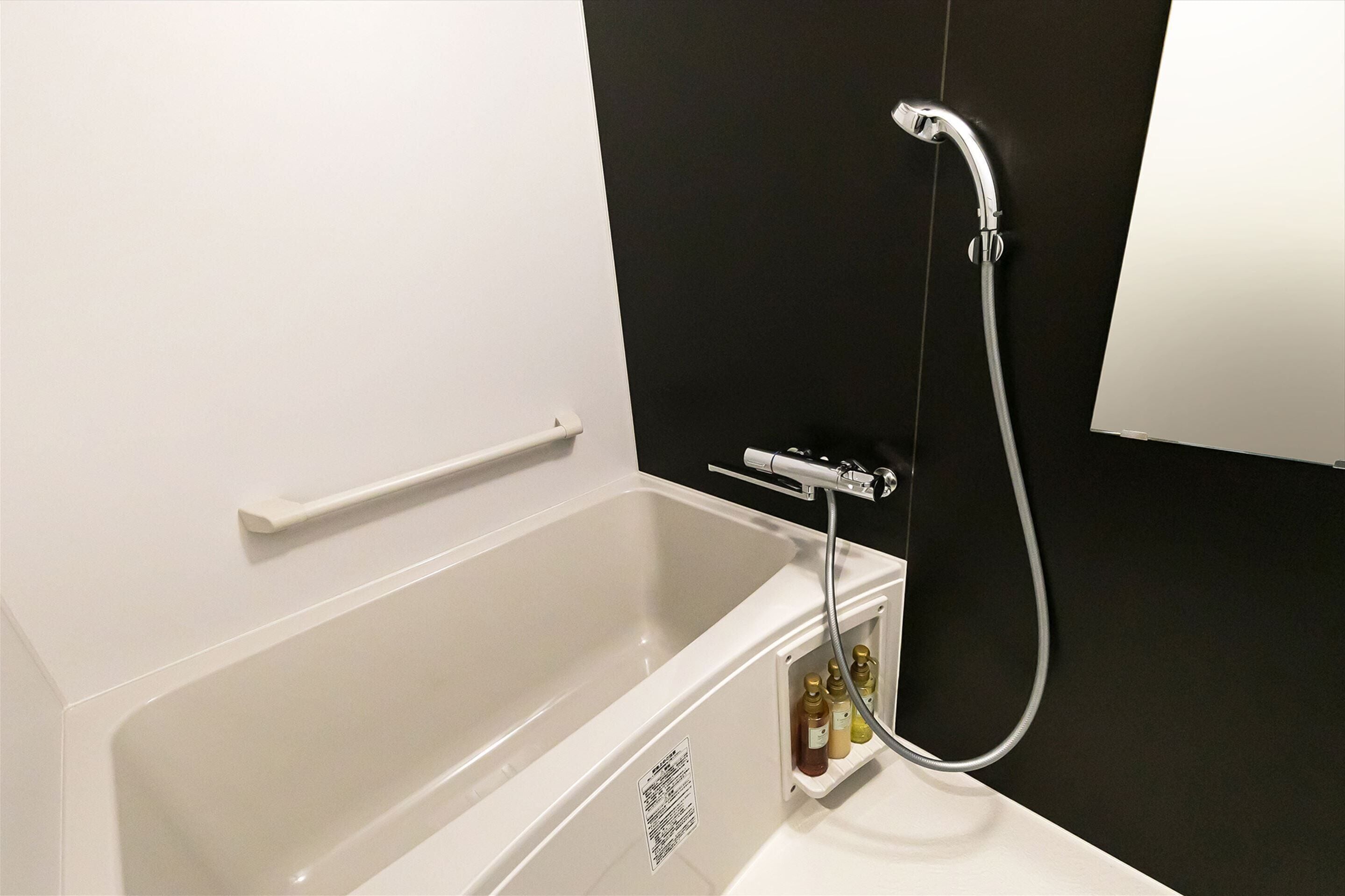 separate bathtub and shower, hair dryer, bathrobes, slippers