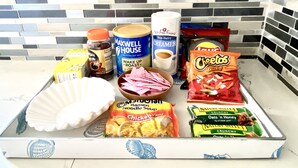 A kitchen counter with various food items and kitchen supplies. - Cozy Apartment unit is Available to Rent (Long Beach)