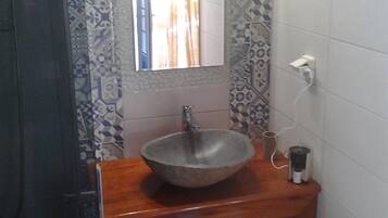 Shower, hair dryer, towels, toilet paper