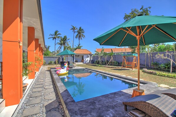 Outdoor pool, pool umbrellas, pool loungers