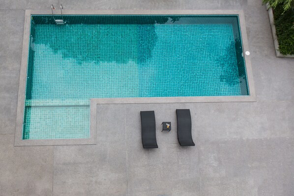 Outdoor pool, open 6:00 AM to 11:00 PM, sun loungers