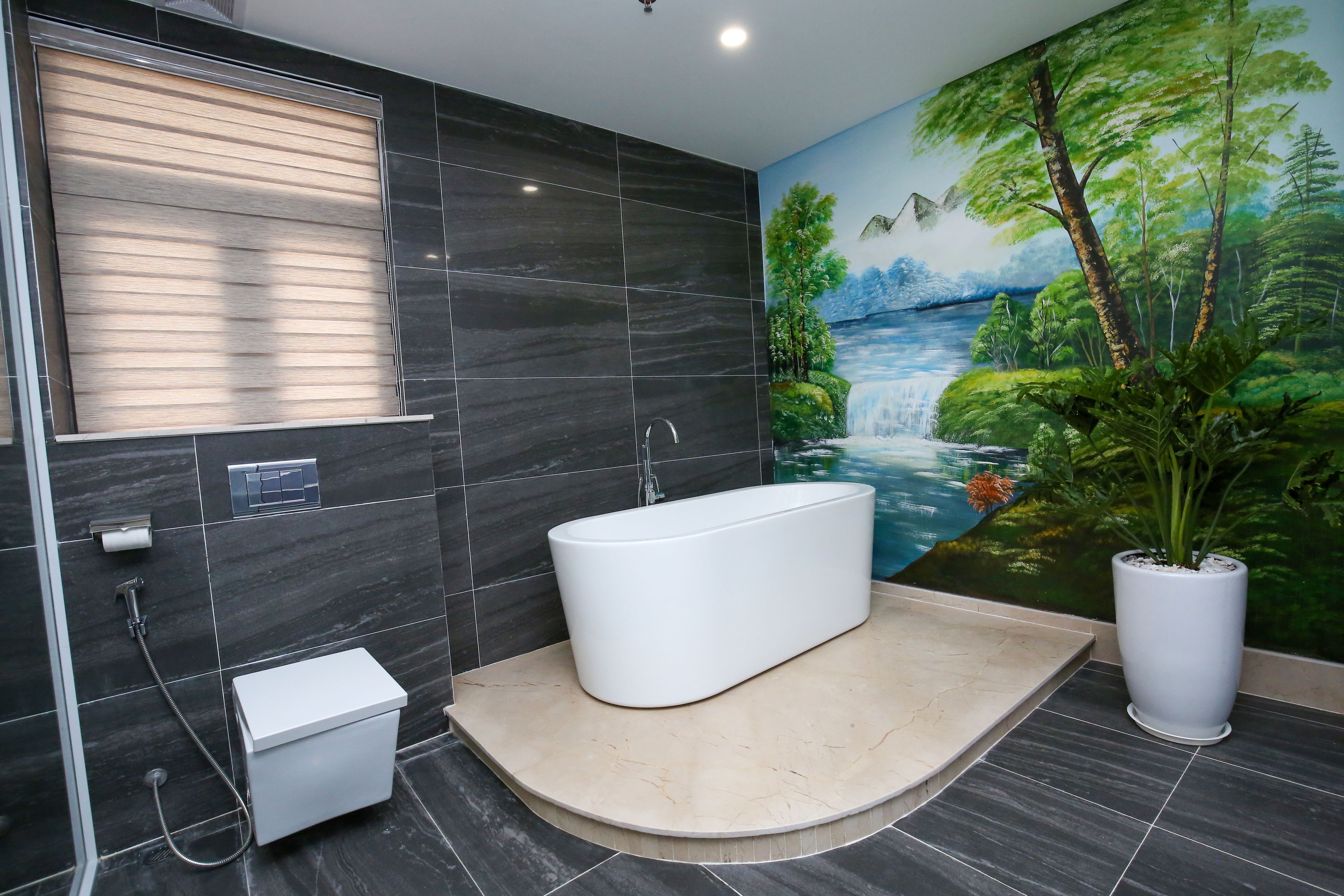 grand suite window city view | bathroom | rainfall showerhead, designer toiletries, hair dryer, bathrobes