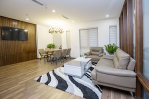 Presidential Suite | Living room | 40-inch Smart TV with cable channels, TV