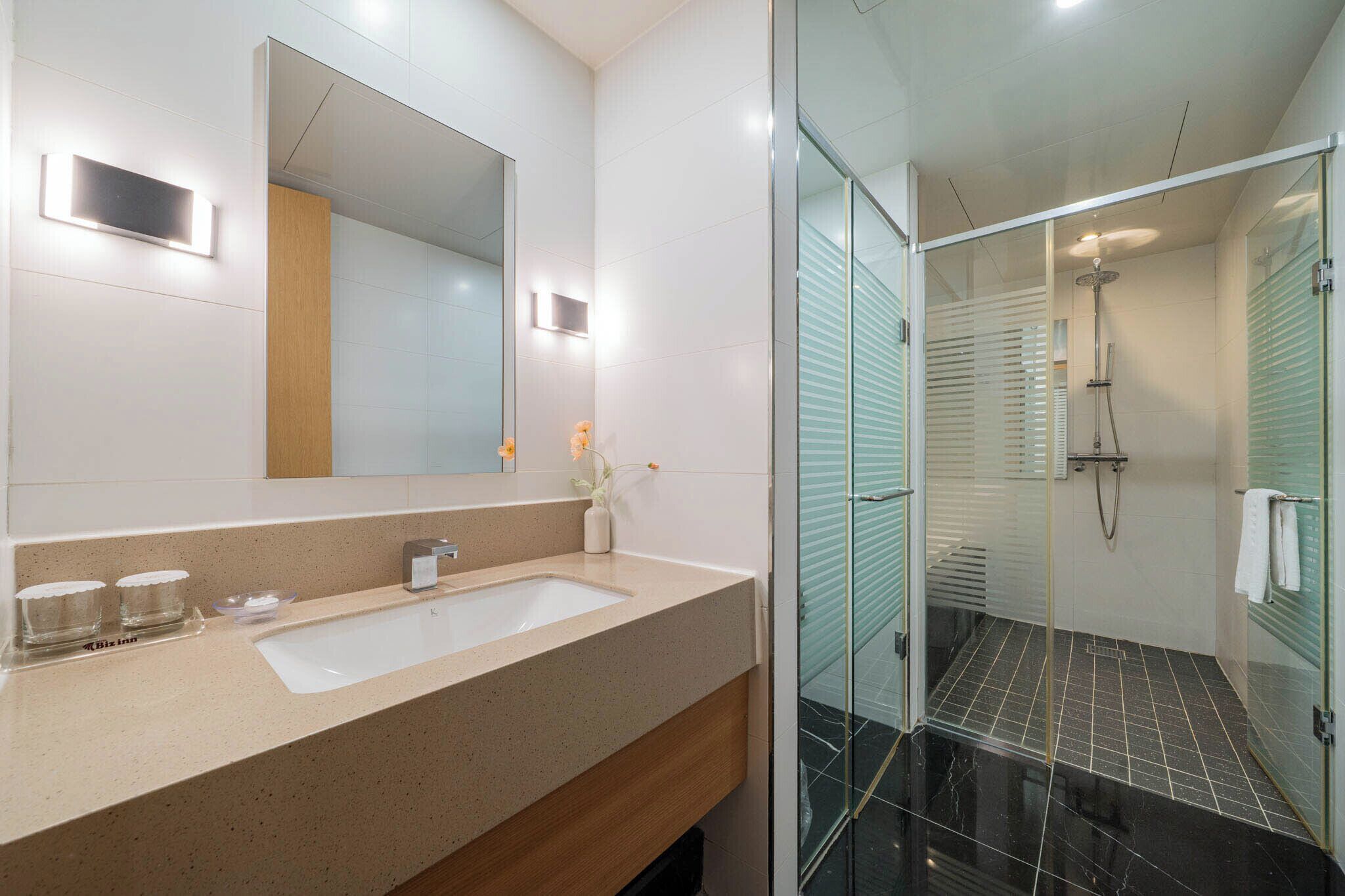 family suite | bathroom | designer toiletries, hair dryer, bathrobes, slippers