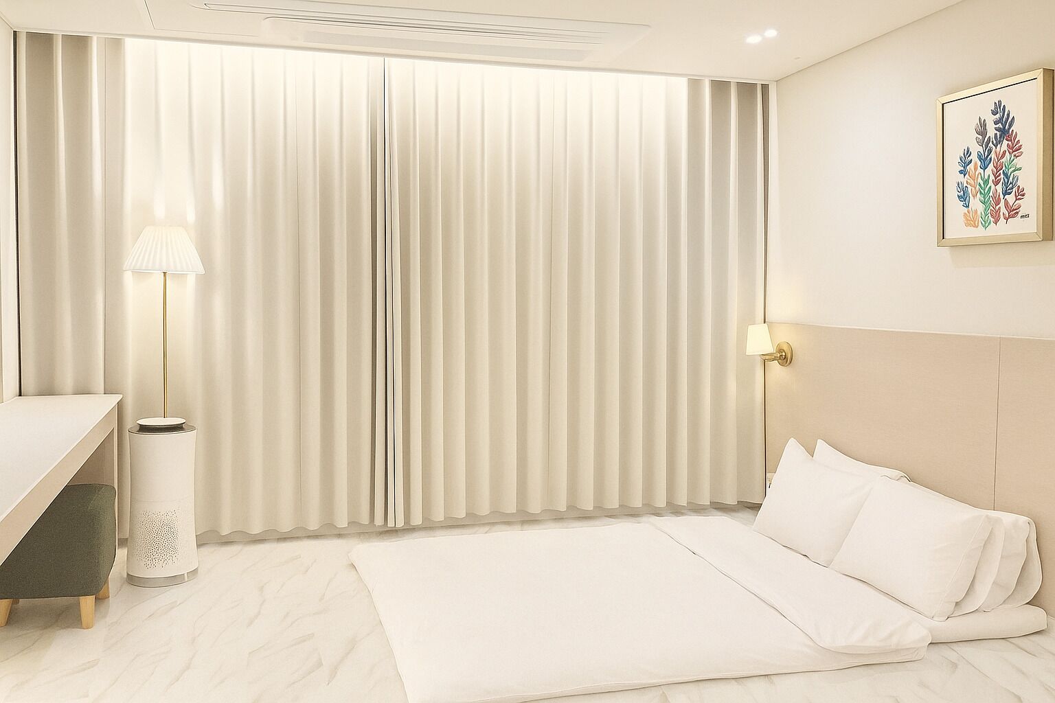 A hotel room with a bed, a bedside table, a lamp, and a wall-mounted picture.